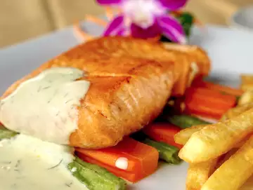 A plate of salmon fish and chips